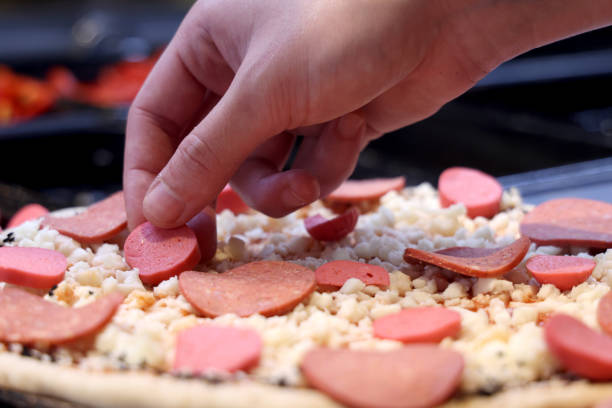 Female chef is preparing pizza