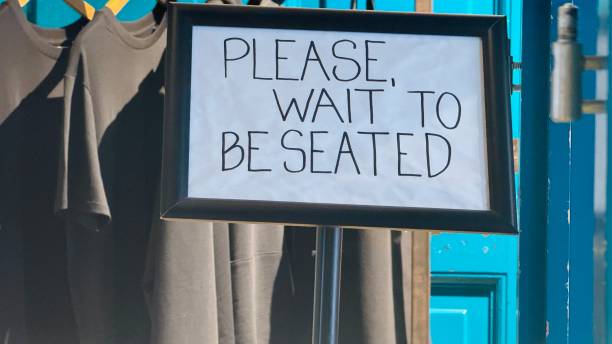 istock Sign please wait to be seated 2166483316