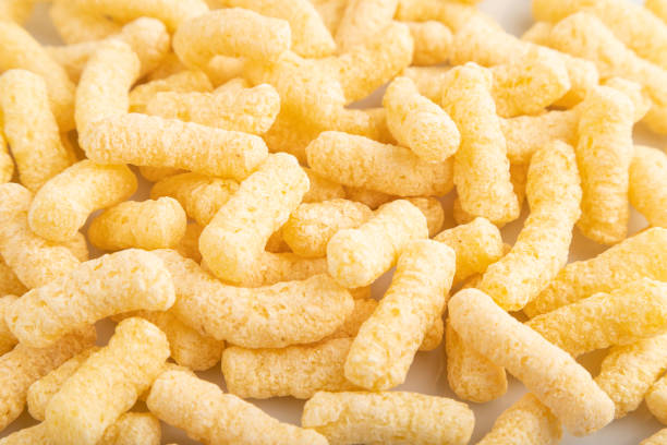 istock Corn flakes sticks with caramel isolated on white, top view, close up. 2166483373