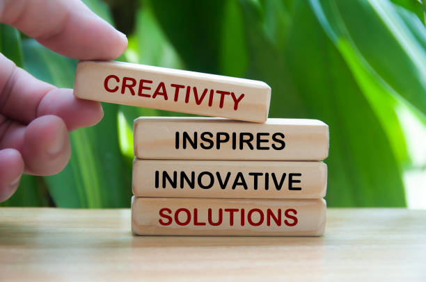 istock Creativity inspires innovative solutions text on wooden blocks with nature background. Personal development concept 2166483554