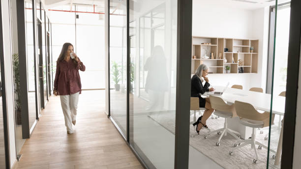 istock Different aged female colleagues working in modern office space 2166483925