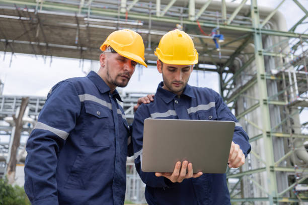 istock Petroleum engineers working at oil refinery site 2166485603
