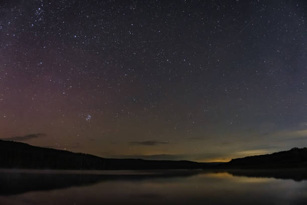 istock starry sky over the lake on a summer night 2166486409
