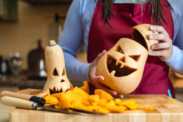 istock alloween Creativity: Family Decorating Pumpkins Together 2166487093