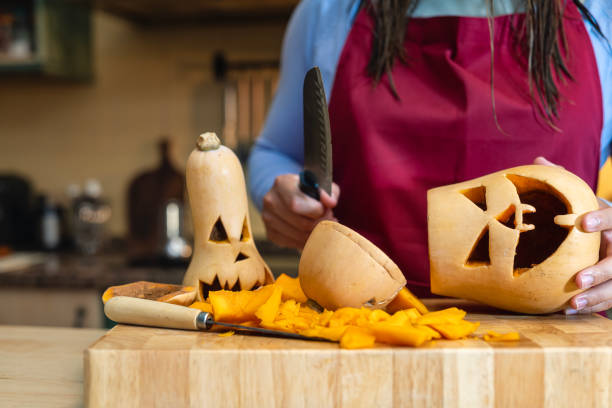 istock alloween Creativity: Family Decorating Pumpkins Together 2166487100