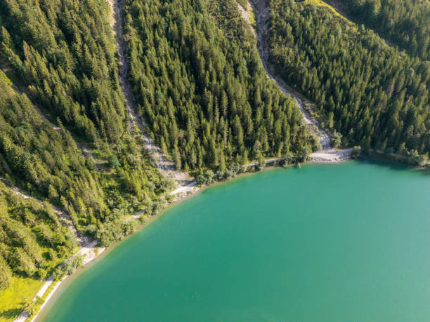 istock Aerial View of Forested Lakeshore with Winding Paths 2166493016