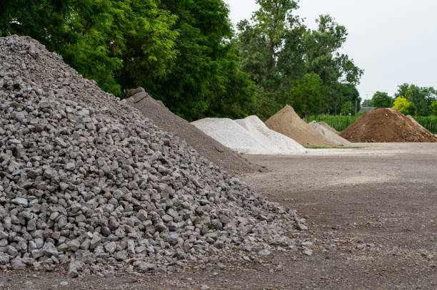 Piles of gravel, pebbles and sand in the countryside Piles of gravel, pebbles and sand in the countryside in summer. Aggregate Materials for Construction and Landscaping stock pictures, royalty-free photos & images