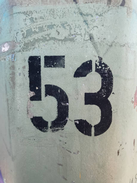 istock A black and white number 53 is written on a green surface 2166494006