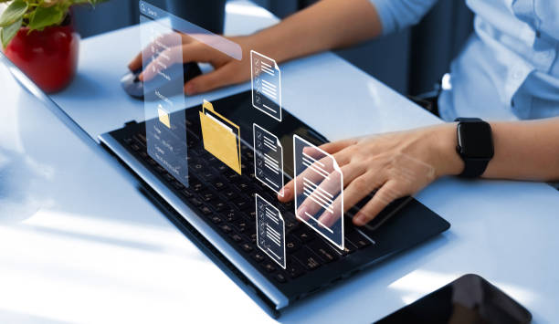 istock Process automation to efficiently manage files. Businesswoman working on laptop with virtual screen. Online documentation database and document management system concept. 2166497923