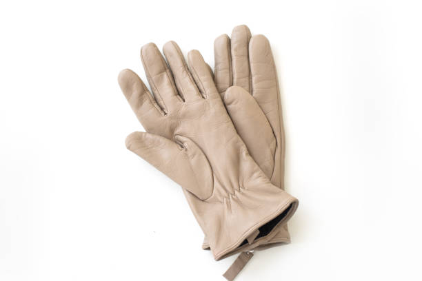 istock Pair of beige leather gloves composition isolated on white background 2166497957