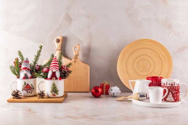 istock Beautiful New Year and Christmas kitchen background with holiday decorations and kitchen utensils on a marble countertop in a modern interior 2166500203