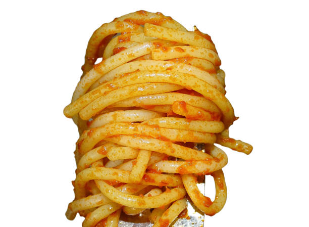 Spaghetti pasta on a white table. Top view. The concept of pasta production