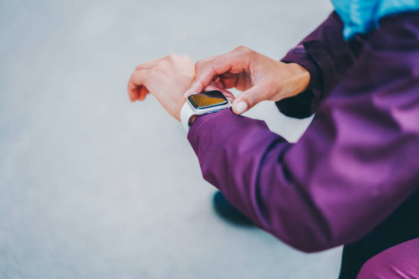 Sportswoman using smart watch during workout