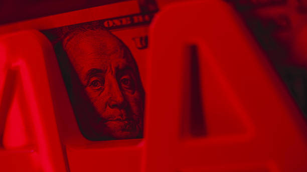 Bill counter counts hundred dollar banknotes for currency exchange