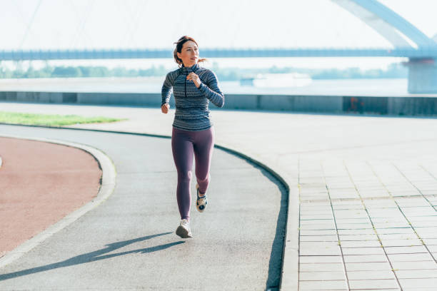 istock Happy sportswoman running 2166508877