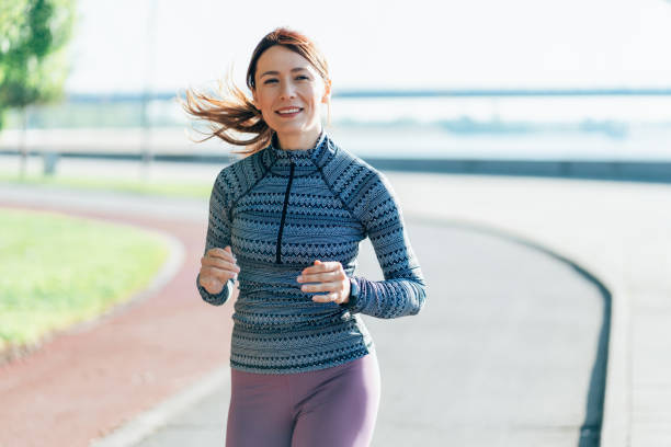 istock Happy sportswoman running 2166508878