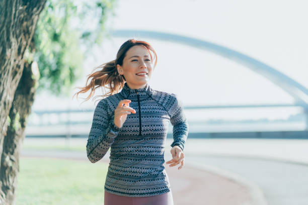 istock Happy sportswoman running 2166508879