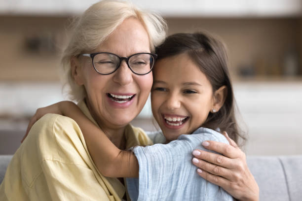 istock Joyful granddaughter and granny hugging with faces touch 2166511229