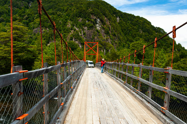 Simpson river National Reserve, Chile -  December 7, 2019: A car crosses  a bridge  over Simpson River in the Simpson river National Reserve,  southern Chile's Aysen Region.