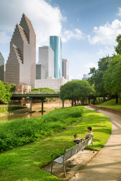 istock University Student working on laptop in city park 2166513837