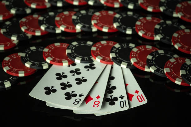istock Playing cards with chips in the background, received from winning or successful combination of two pairs. Concept of winning in poker club 2166515149