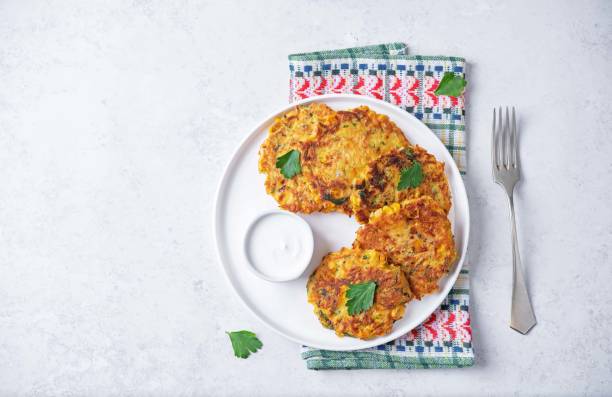 istock Corn fritters wih cream sauce in a plate 2166515325