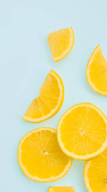 istock Background with lemons with place for text. Lemon slices isolated on a light background, fresh and juicy lemon, clipart. High resolution photo of citrus fruits and sliced lemon. 2166515767