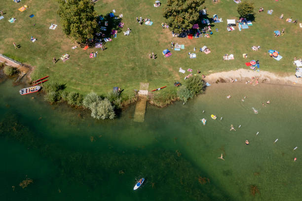istock Lake and people swimming and sunbathing 2166519896