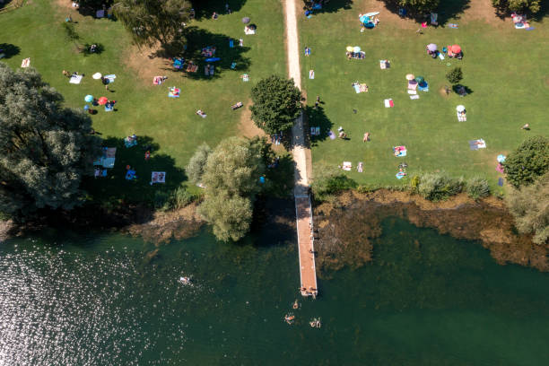 istock Lake and people swimming and sunbathing 2166520697