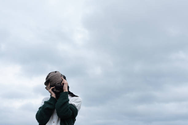 In an abandoned house near by sea and mountain Generation Z non-binary person exhibiting mental problems. \ntransgender, 20-29 years old, self healing