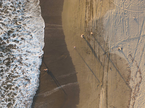 istock Family play at ocean beach 2166522019