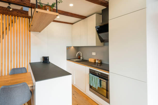 istock Modern Apartment Kitchen Interior with Wooden Accents 2166525046