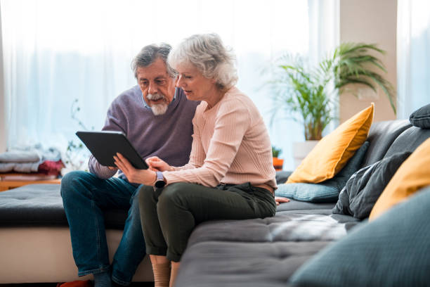 istock Senior Couple Engages with Technology 2166525146