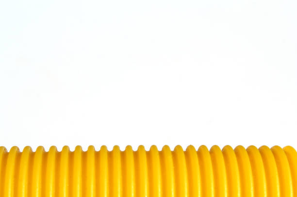 Yellow corrugated surface against a white background abstract