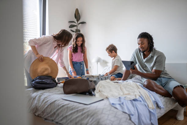 istock Diverse Family Engages in Packing for a Trip 2166530597