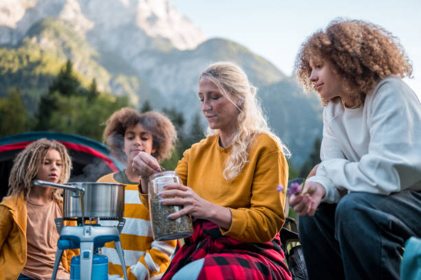 istock Family Camping Meal Preparation 2166532579