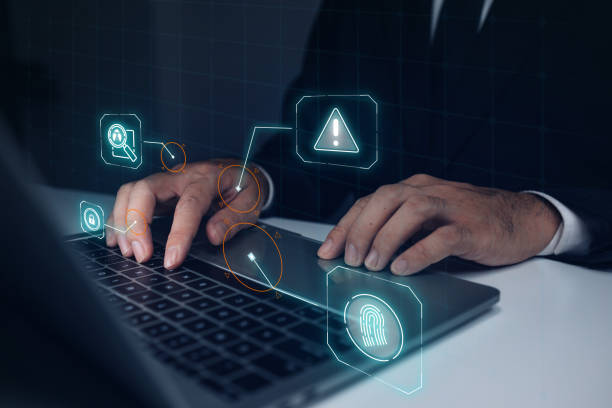 istock A man is typing on a laptop with a green screen that has a fingerprint symbol on it. Concept of security and protection, as the fingerprint symbol is often used to identify individuals 2166533359
