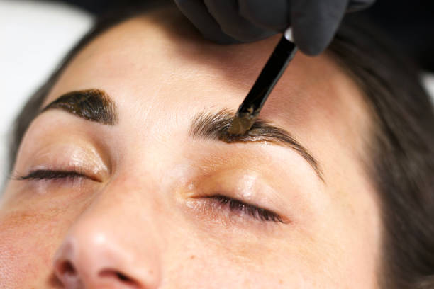 istock Applying Eyebrow Tint During Beauty Treatment 2166547515