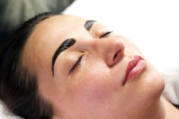 istock Woman Relaxing During Eyebrow Tinting Session 2166547549
