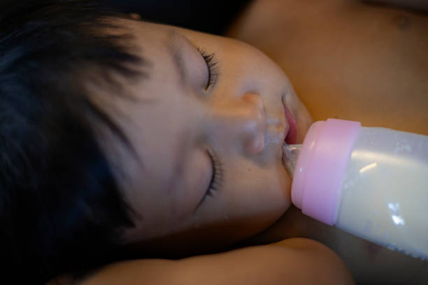 Newborn baby boy sleeping on the bed, little baby