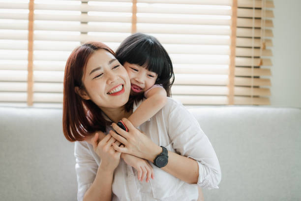istock A woman is hugging a small child 2166550634
