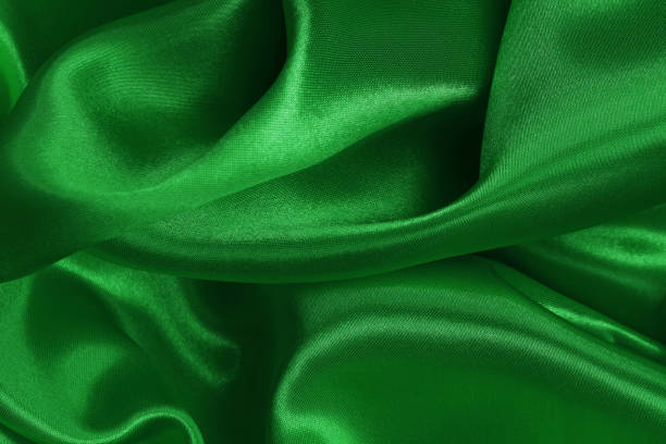 istock Green emerald fabric texture background, detail of silk or linen pattern. 2166553258