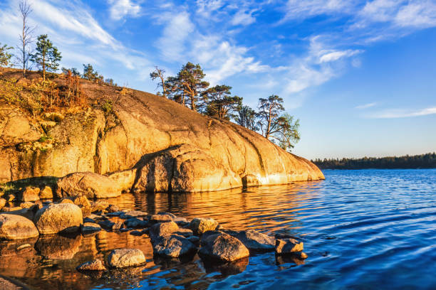 Beautiful light on rocks by the sea on a summer evening
