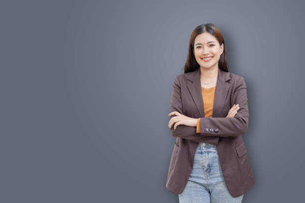 istock Smiling  asian woman look at camera isolated on background studio portrait. 2166554455