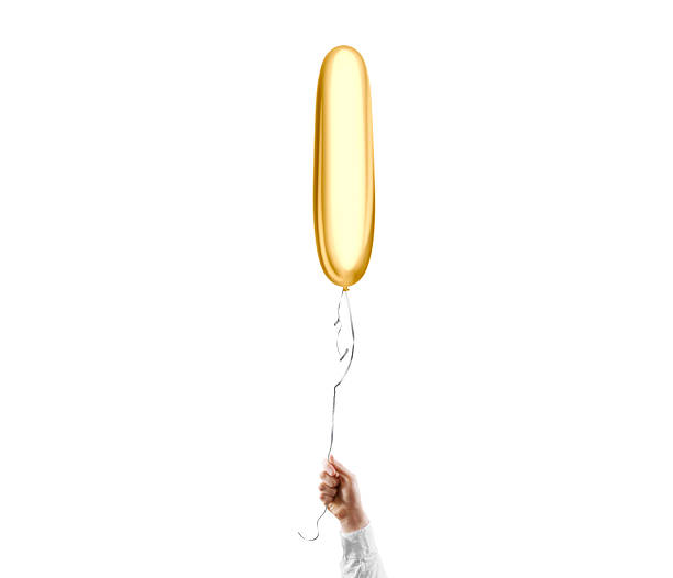 istock Hand holding blank gold cylindrical balloon mockup, isolated 2166558428