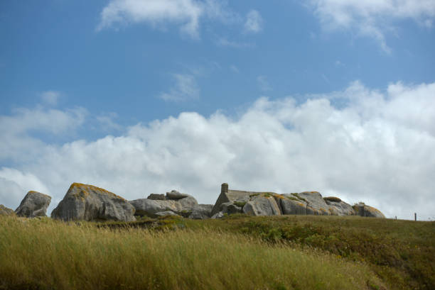 istock Isolated house and rocks 2166559071