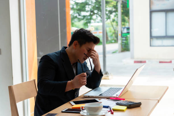 istock young asian businessman in panic in a office and Stressed about work 2166559685