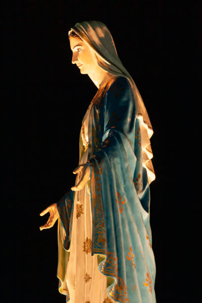 istock Side view of the Virgin Mary statue at night. 2166563257
