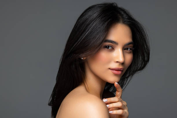 istock Beautiful woman face close up studio on dark background 2166564687