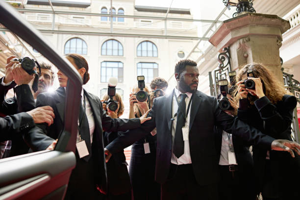 Security staff managing media at celebrity event